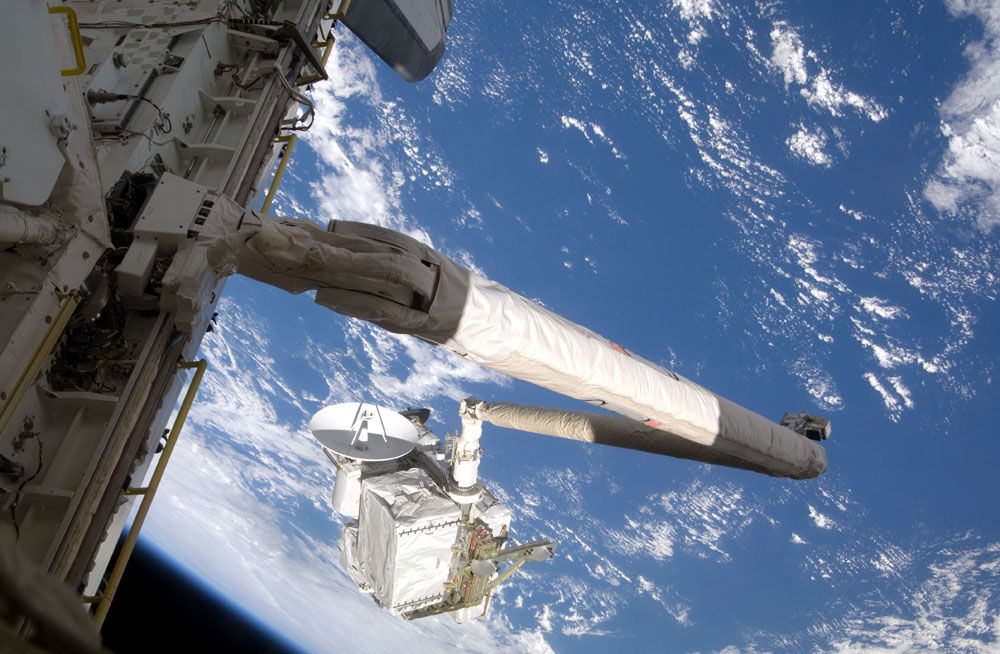 international space station pictures. A new ISS arm, Dextre,