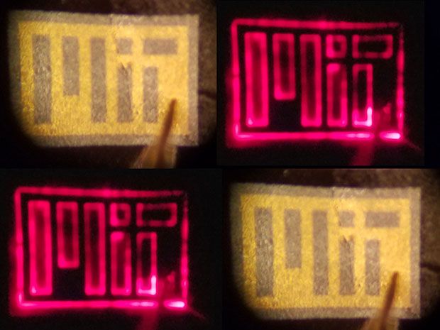 Four images of a small flexible sheet that reads "MIT" in blocky letters. Two of the images glow red.