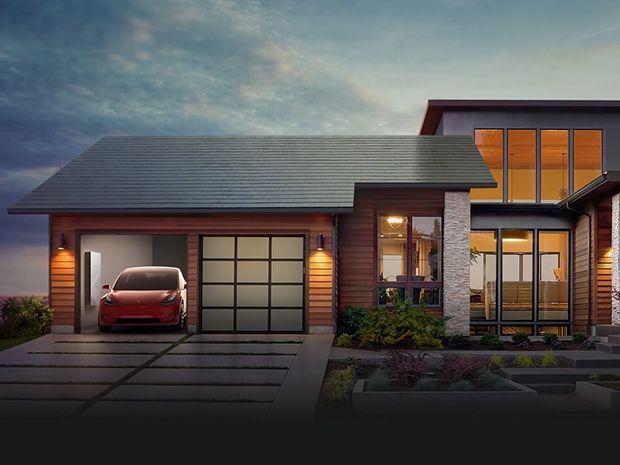 A home pictured with Tesla's solar roof, a car, and new Powerwall battery as the sun falls