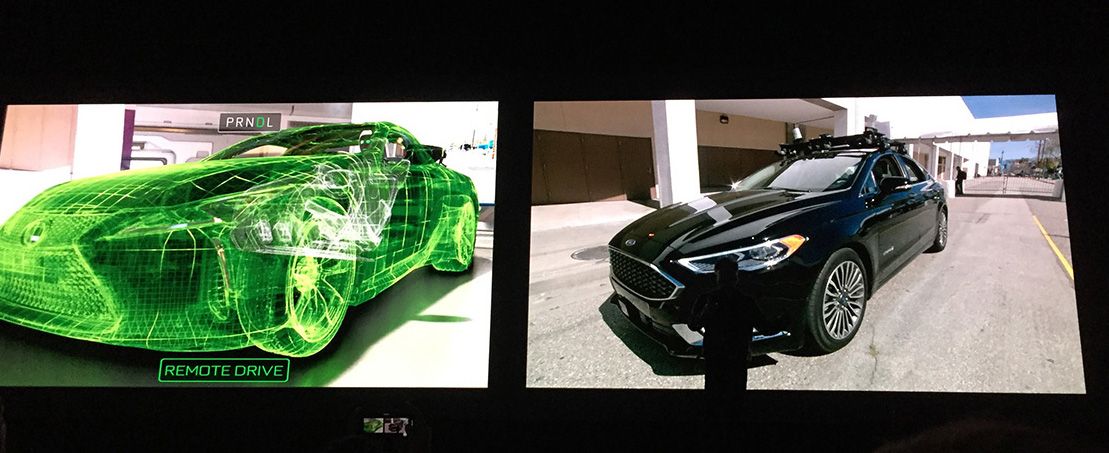 Image of a VR car next to a real car is shown at the GTC 2018 conference 
