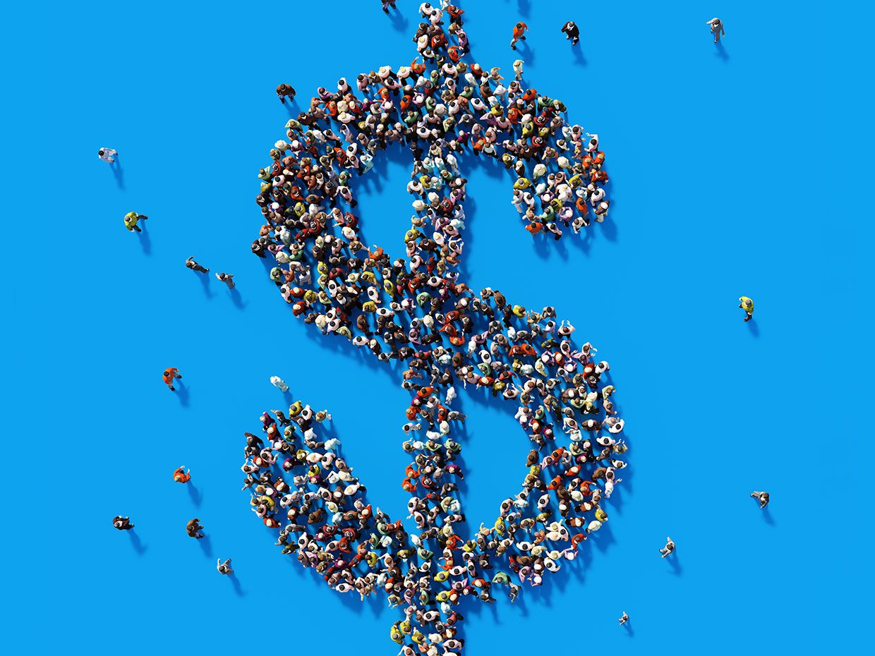 Conceptual photograph of a crowd of miniature people forming a dollar sign.