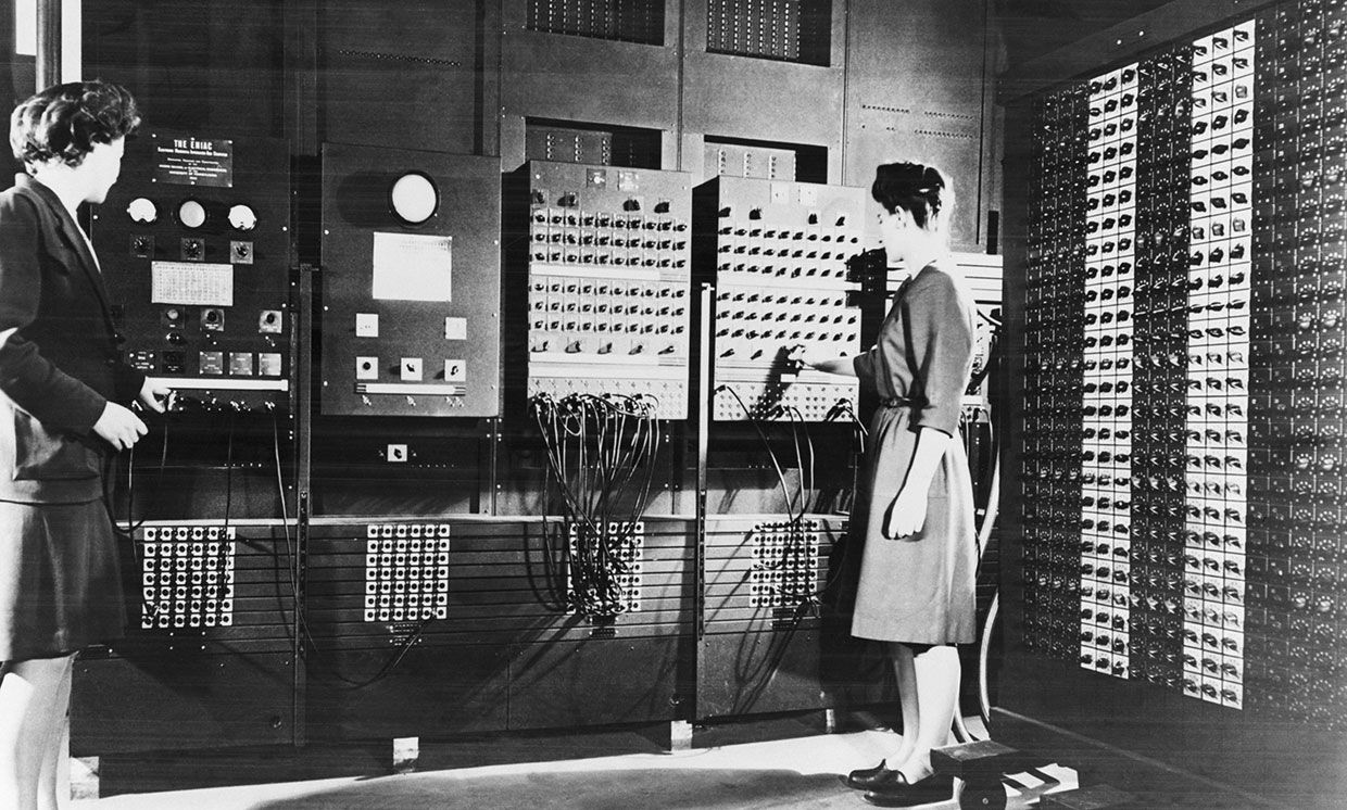 Betty Jennings (left) and Frances Bilas operating the ENIAC's main control panel. 