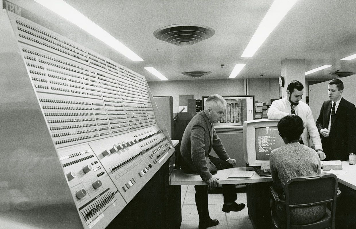1968. Flanked by a display console with an array of lights and switches, an operator uses a monitor to check the performance of the Model 91. This System/360 installed at NASA's Goddard Space Flight Center in Greenbelt, Md.