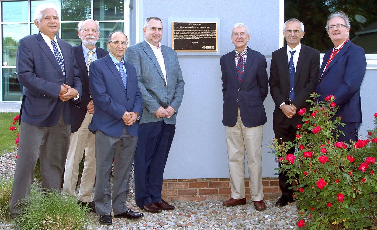 Representatives from the IEEE Power Electronics Society unveil the Milestone plaque for the silicon-controlled rectifier on 14 June 2019. From left: Sreeram Dhurjaty, John Kassakian, Ahmed Elasser, James Mazzarella, José Moura, Frede Blaabjerg, and Gerard Hurley