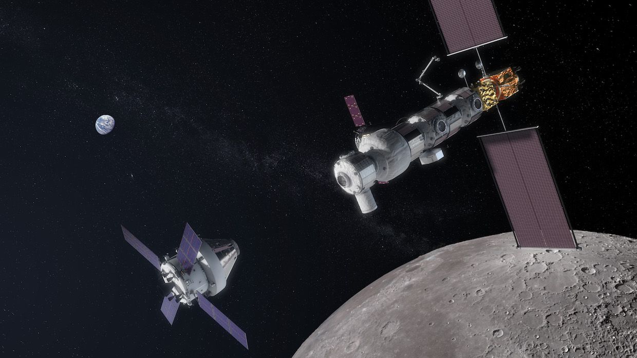 Gateway lunar orbiting station with Orion module approaching.