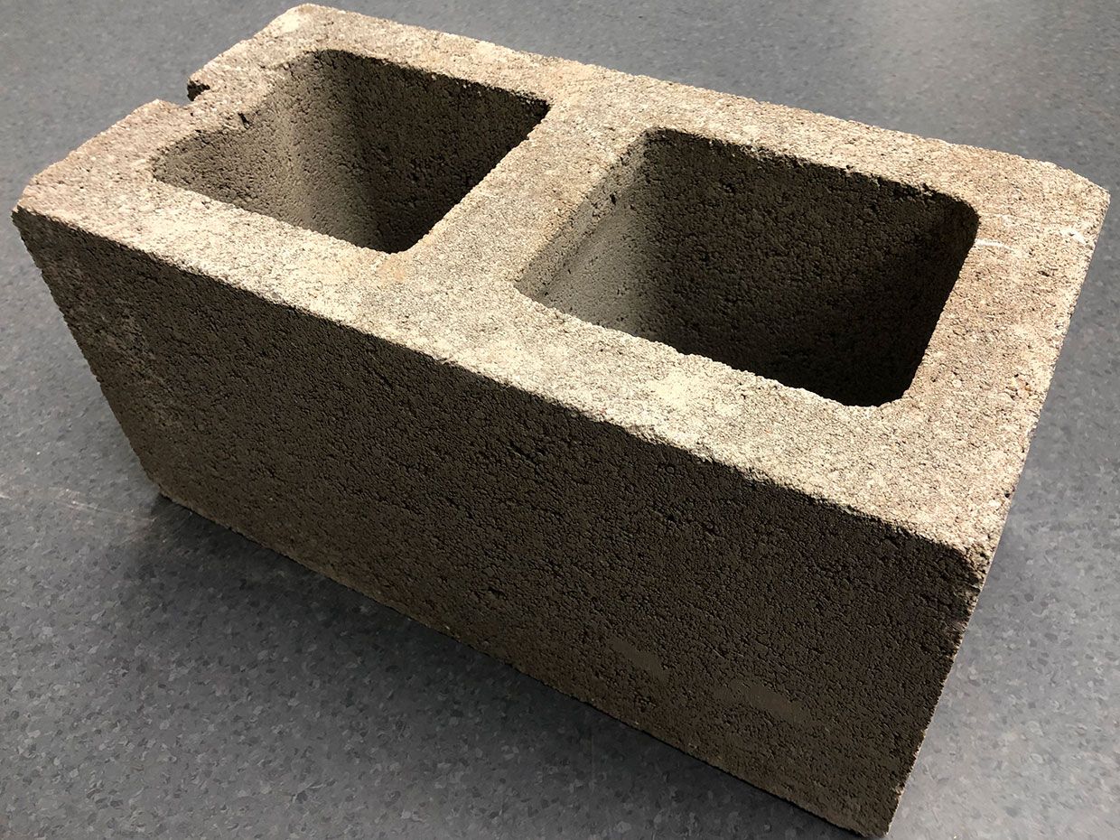 A cinder block made using UCLA's carbon-to-concrete system.