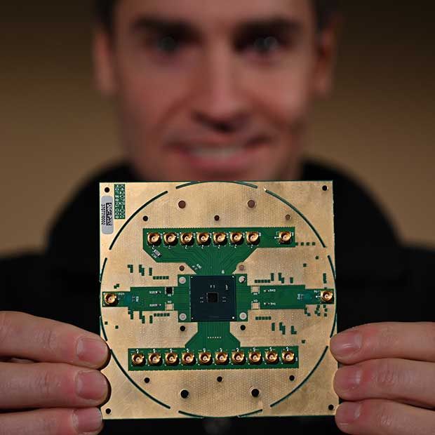 Stefano Pellerano, principal engineer at Intel Labs, holds Horse Ridge, a cryogenic control chip