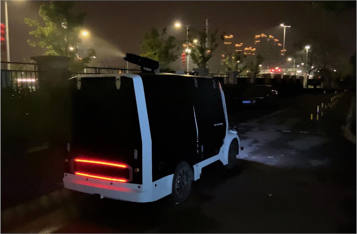Autonomous vehicle developed by Unity Drive Innovation (UDI) sprays disinfectant near a hospital in Shenzhen, China, during the COVID-19 pandemic