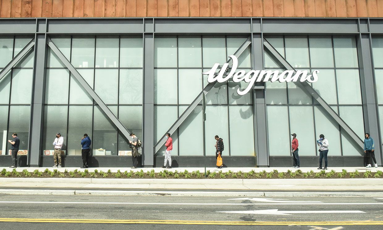 Shoppers wait their turn to buy groceries at a Wegmans supermarket in Brooklyn, N.Y., on 7 April.