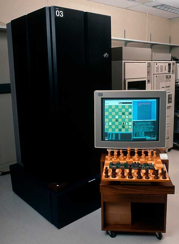 Photo of Deep Blue, an older PC and a chessboard.