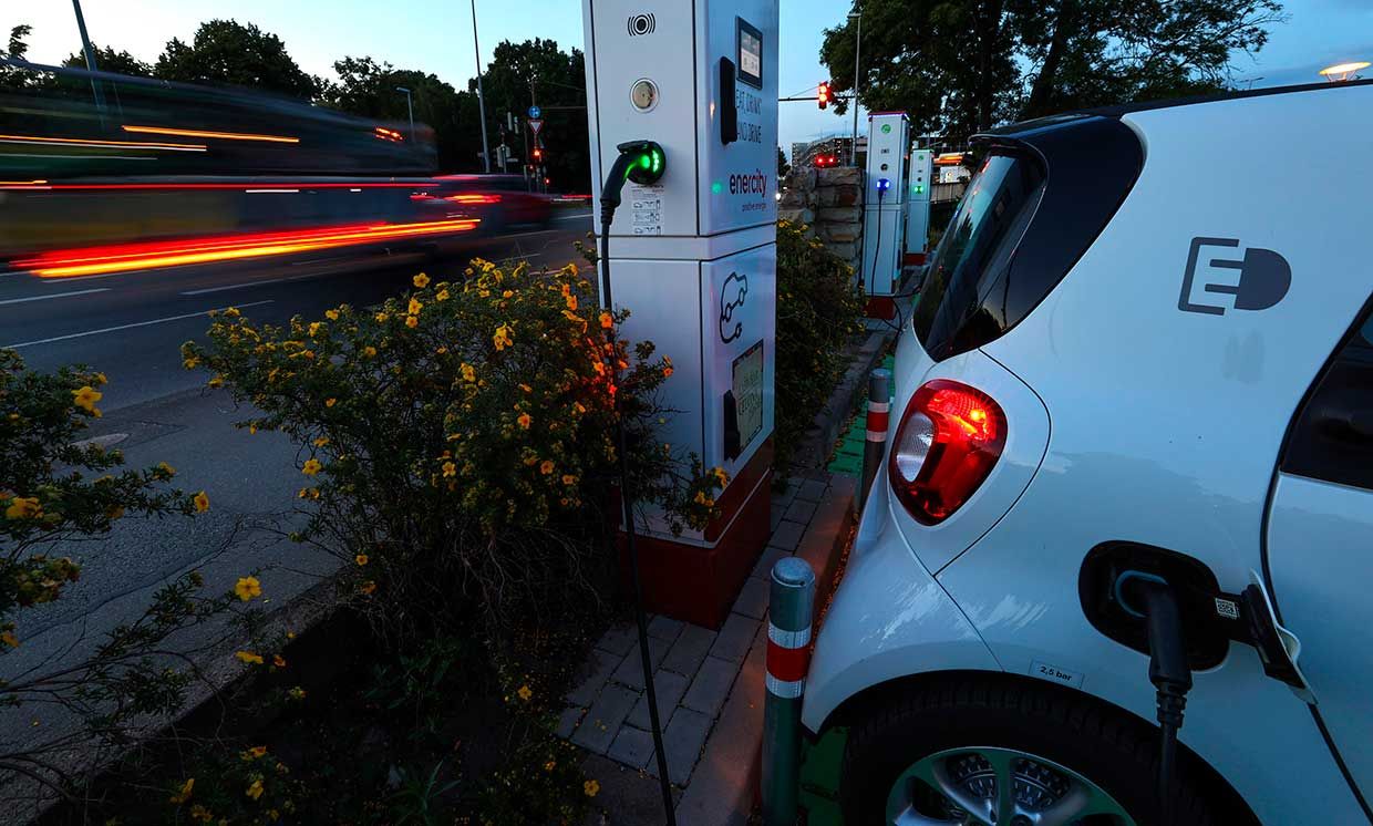 A car charging at a charging station.  