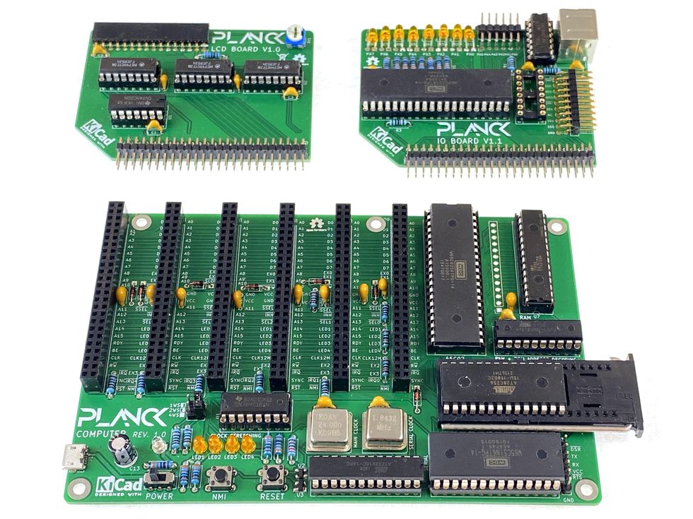 1 large green circuit board and two smaller ones, all labelled "Planck"