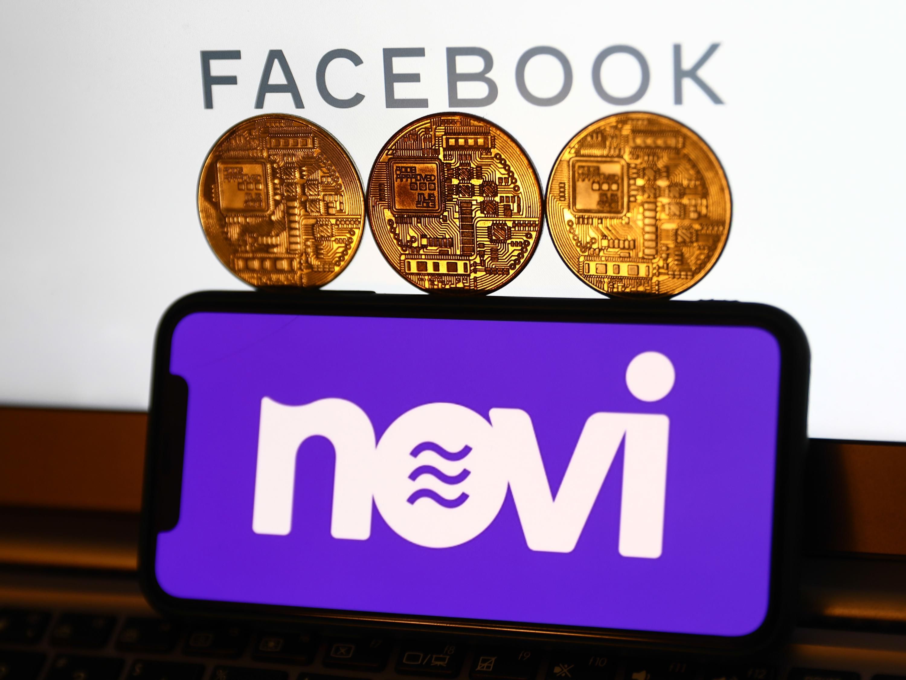 3 gold coins that appear to be etched to look like computer chips sit on top of a phone with the Novi logo. Above the coins is the logo for Facebook.