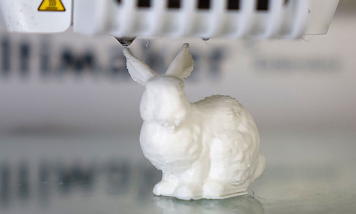 A 3D printed bunny-shaped object that contains DNA encoding the digital instructions for its fabrication.