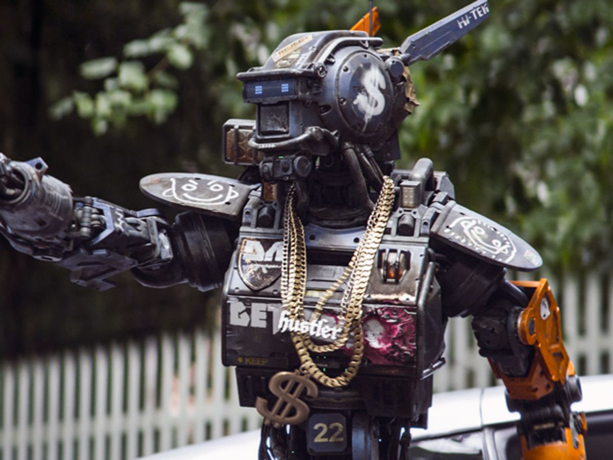 A bipedal robot, covered in graffiti and wearing several gold chains.