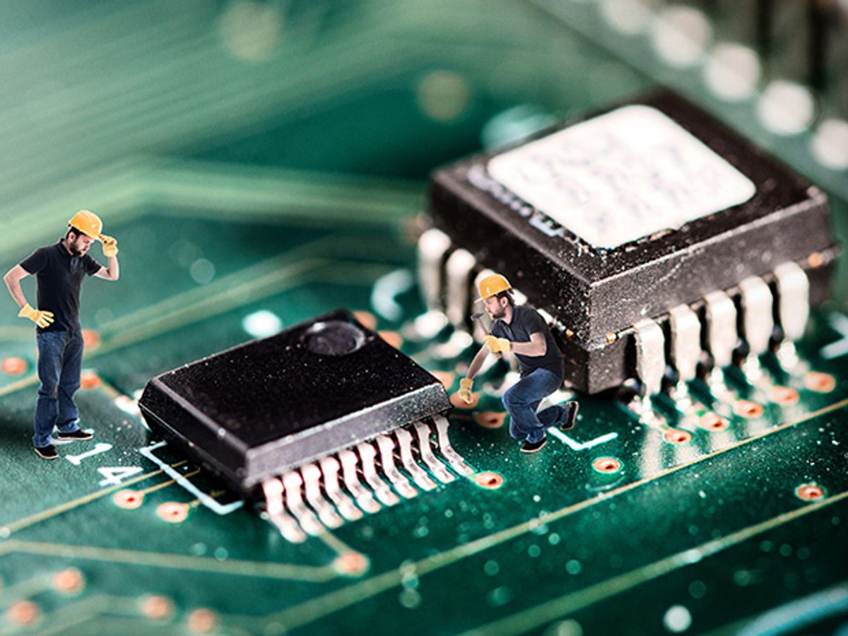 A black computer chip with miniature construction workers inspecting it.