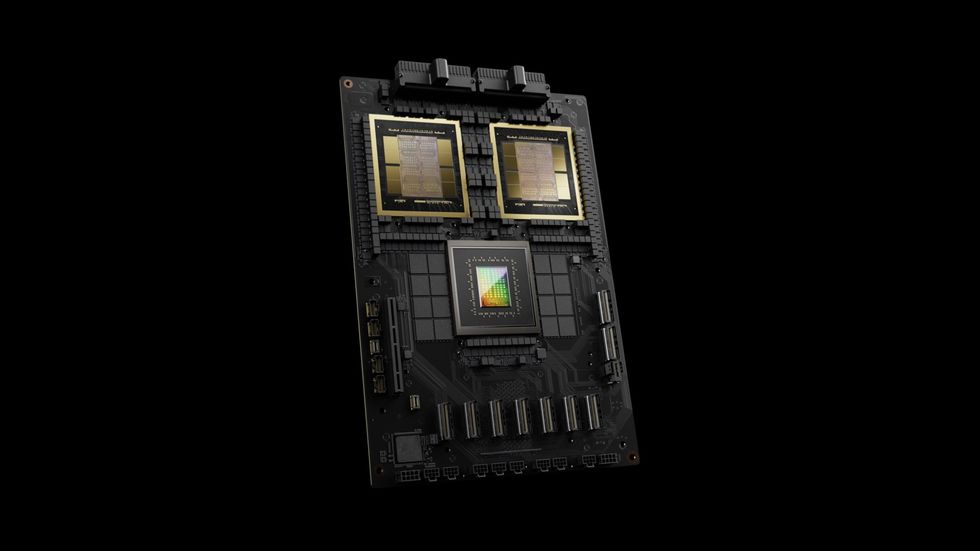 A black, textured circuit board with two gold rectangles at top and one rainbow rectangle at center.
