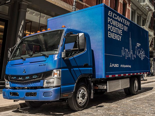 A blue, medium-sized truck with the words "eCanter Powered by Positive Energy" on the side