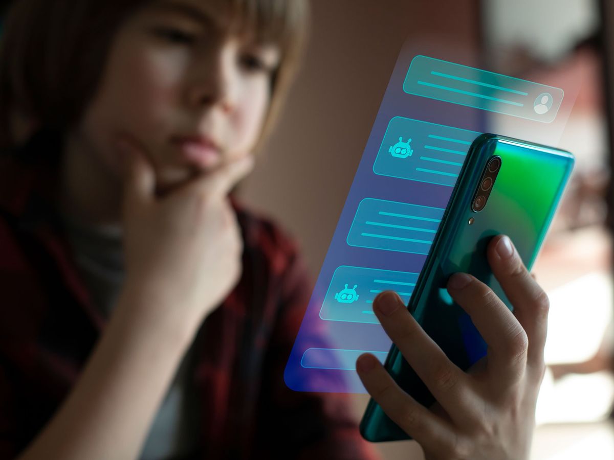 A child holds a phone with blue boxed screen showing a stylized chatbot conversation