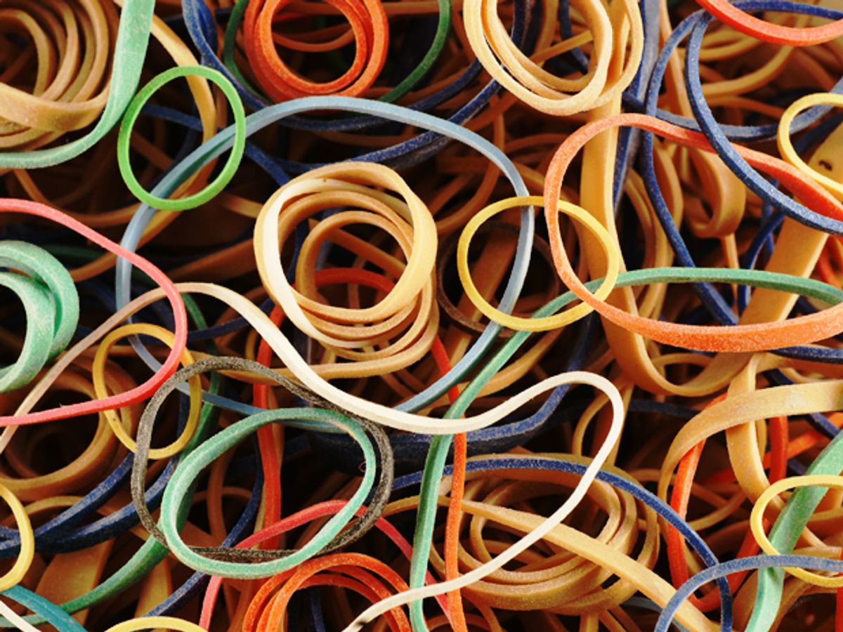 A close up look at a pile of multicolor rubber bands of many sizes.