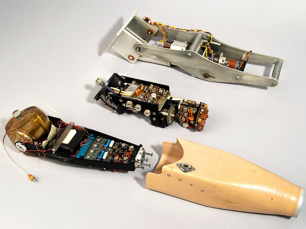 A color photo of a prosthetic arm showing the electronics exposed.
