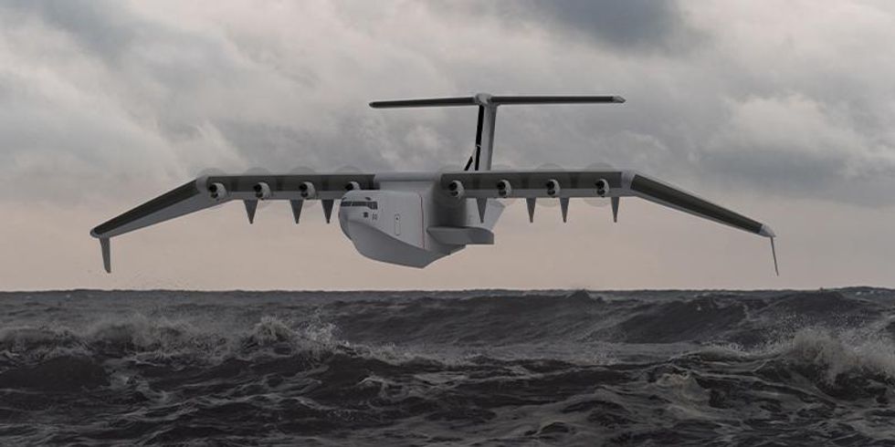 A concept rendering of a large grey seaplane flying over the ocean just above the waves