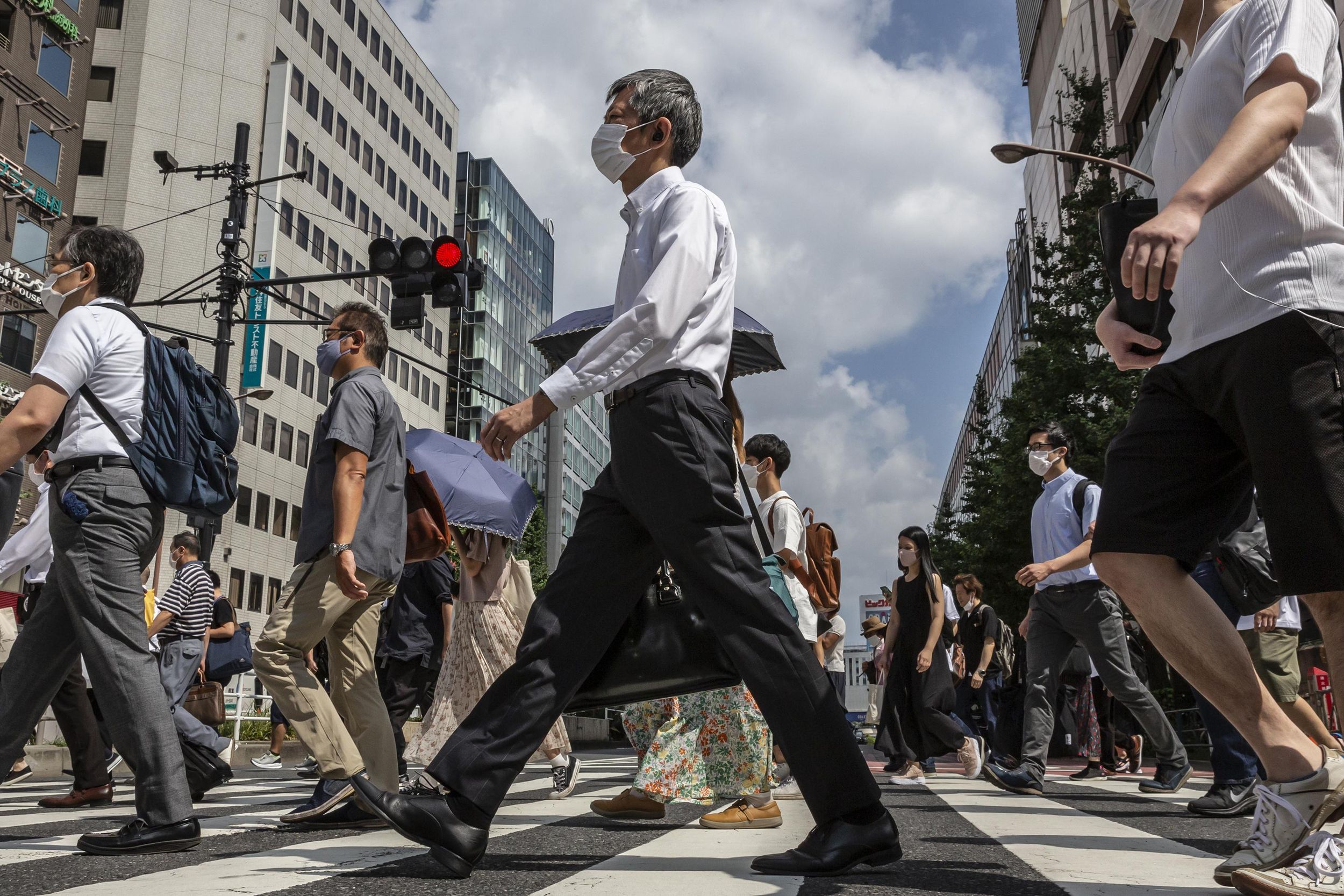 A crowd of people in Japan crossing the street 