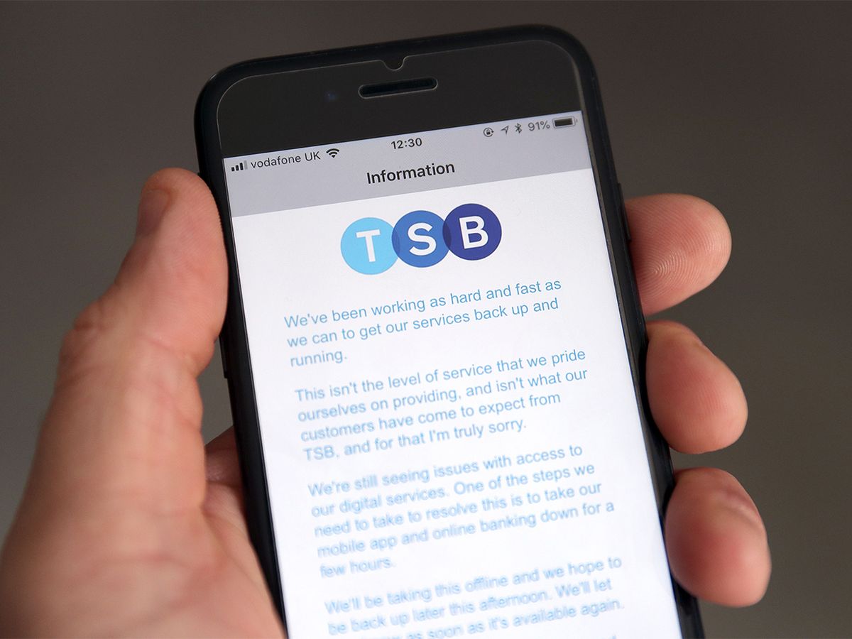 A customer using the TSB Online banking app on an iPhone reads a message from TSB CEO Paul Pester apologizing for IT issues which left online customers unable to access their money and some able to see other people's accounts.