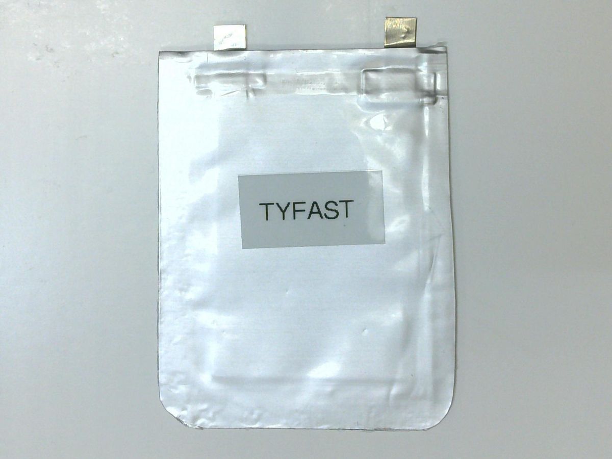 A foil rectangle labelled Tyfast, with two silver squares coming out of the top. 