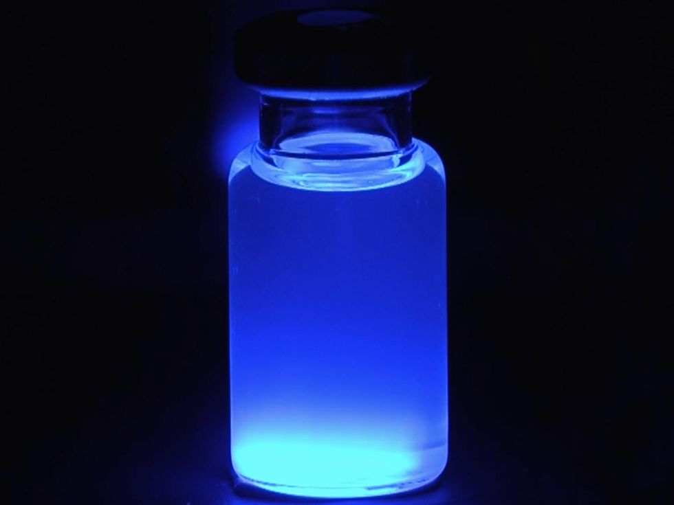 a-glass-vial-full-of-a-glowing-liquid.jp