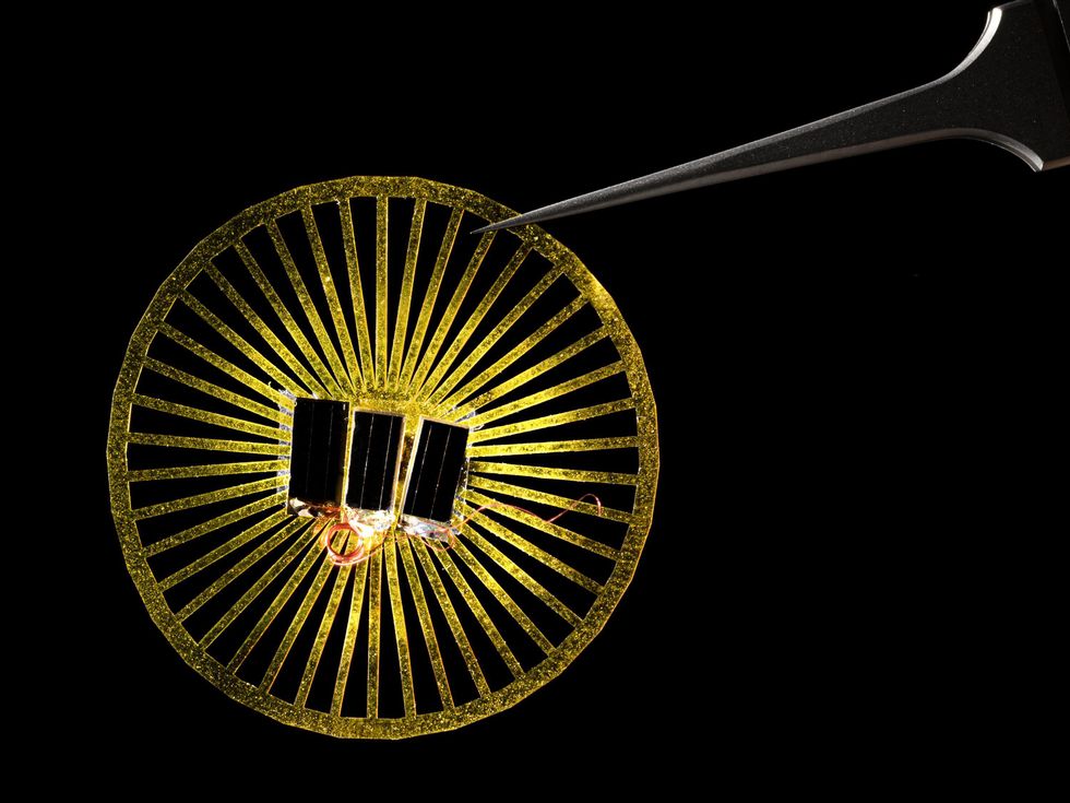 A golden, parachute-shaped sensor is designed to mimic the behavior of dandelions\u2019 fuzzy spores.