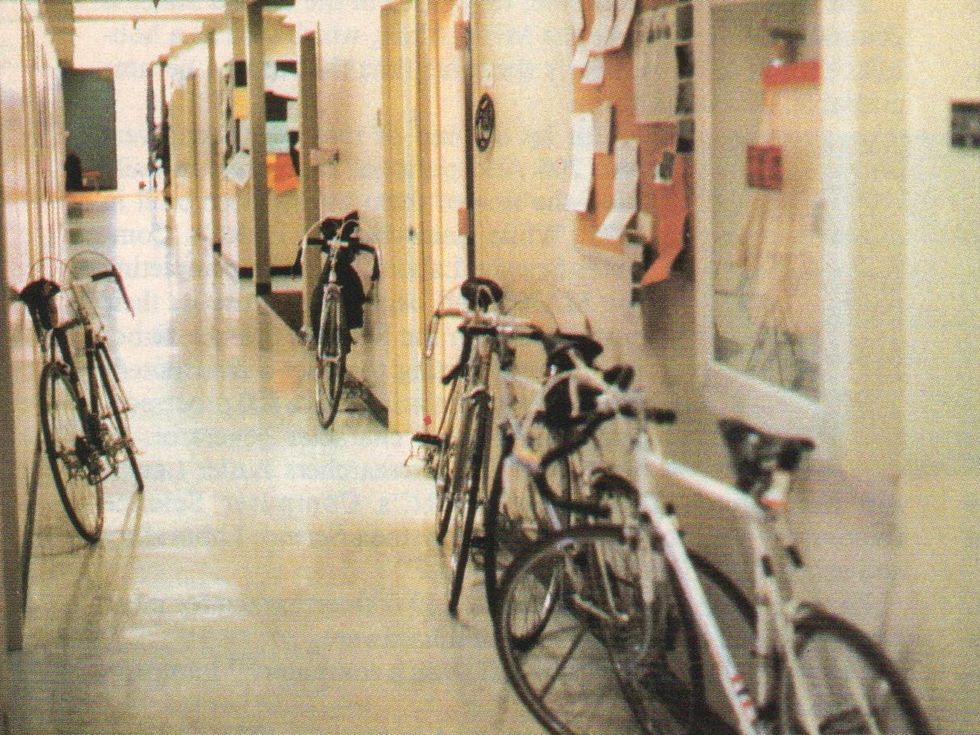 A hallway lined with bicycles