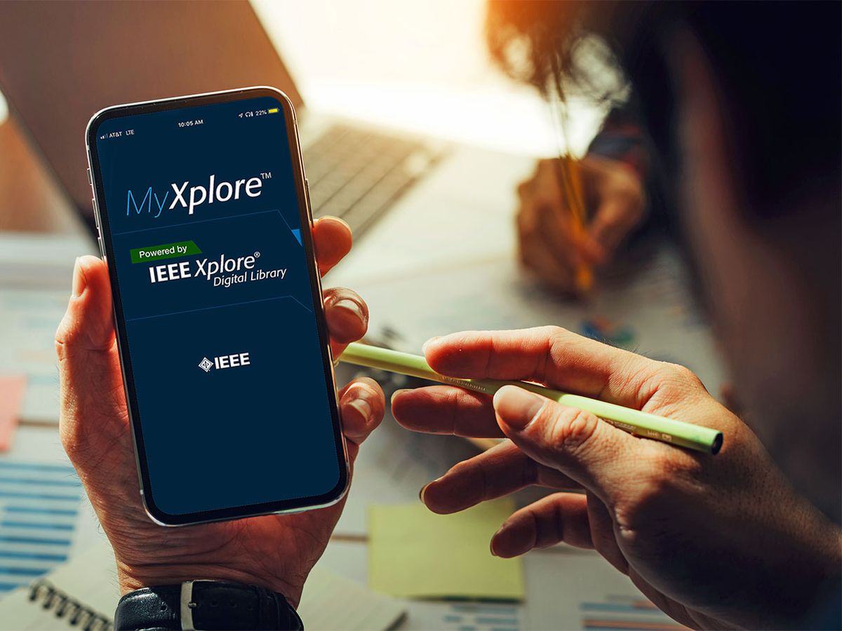 A hand holding a phone with the MyXplore app showing on it.