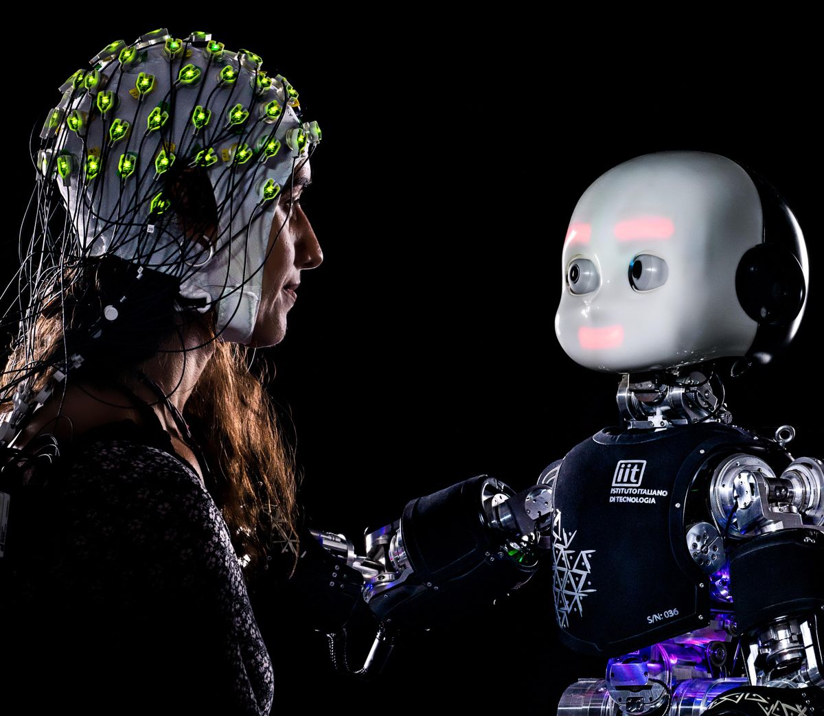 A humanoid robot gazing at a human wearing a sensorized hat