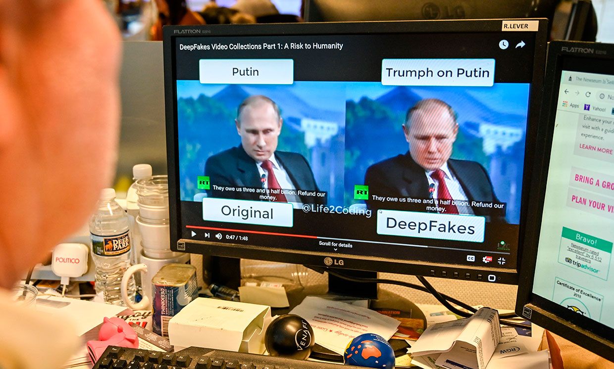A journalist views a video manipulated with artificial intelligence to potentially deceive viewers, or &ldquo;deepfake&rdquo; at his newsdesk in Washington, DC