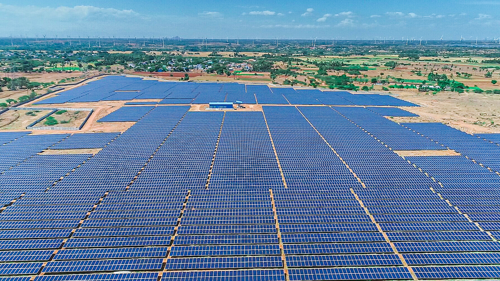 A large flat field covered in solar panels.