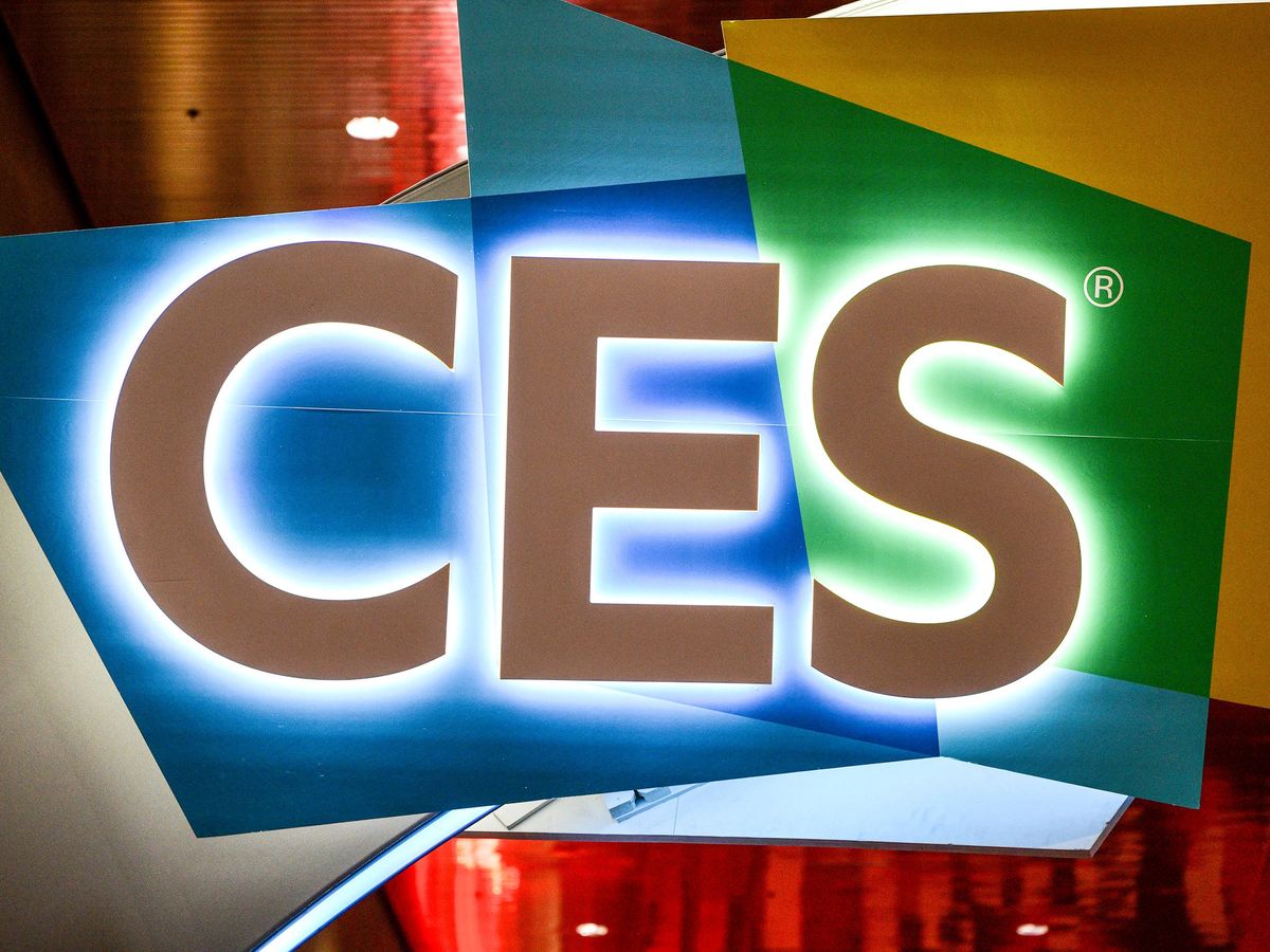 a large sign reading CES backlit against blue and green colors