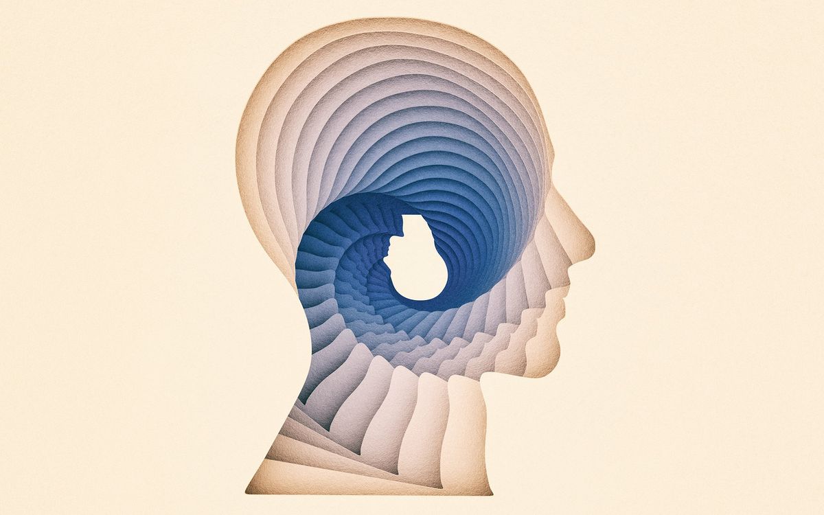 A layer of cream and blue silhouetted heads forming a swirl resulting in an upside down head within the head.