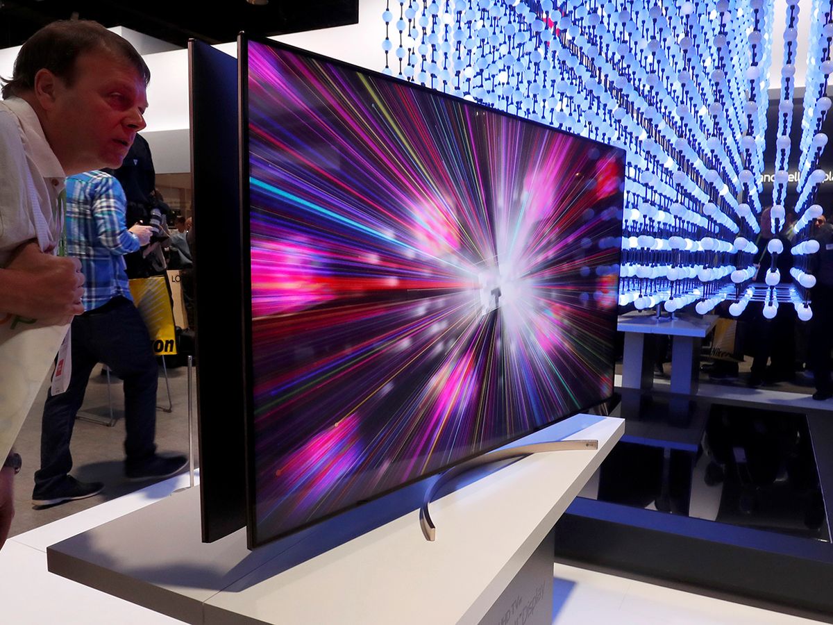 A man looks over a 4K Super UHD TV Nano Cell display in the LG Electronics booth at the Las Vegas Convention Center during the 2018 CES in Las Vegas, Nevada, U.S. January 9, 2018