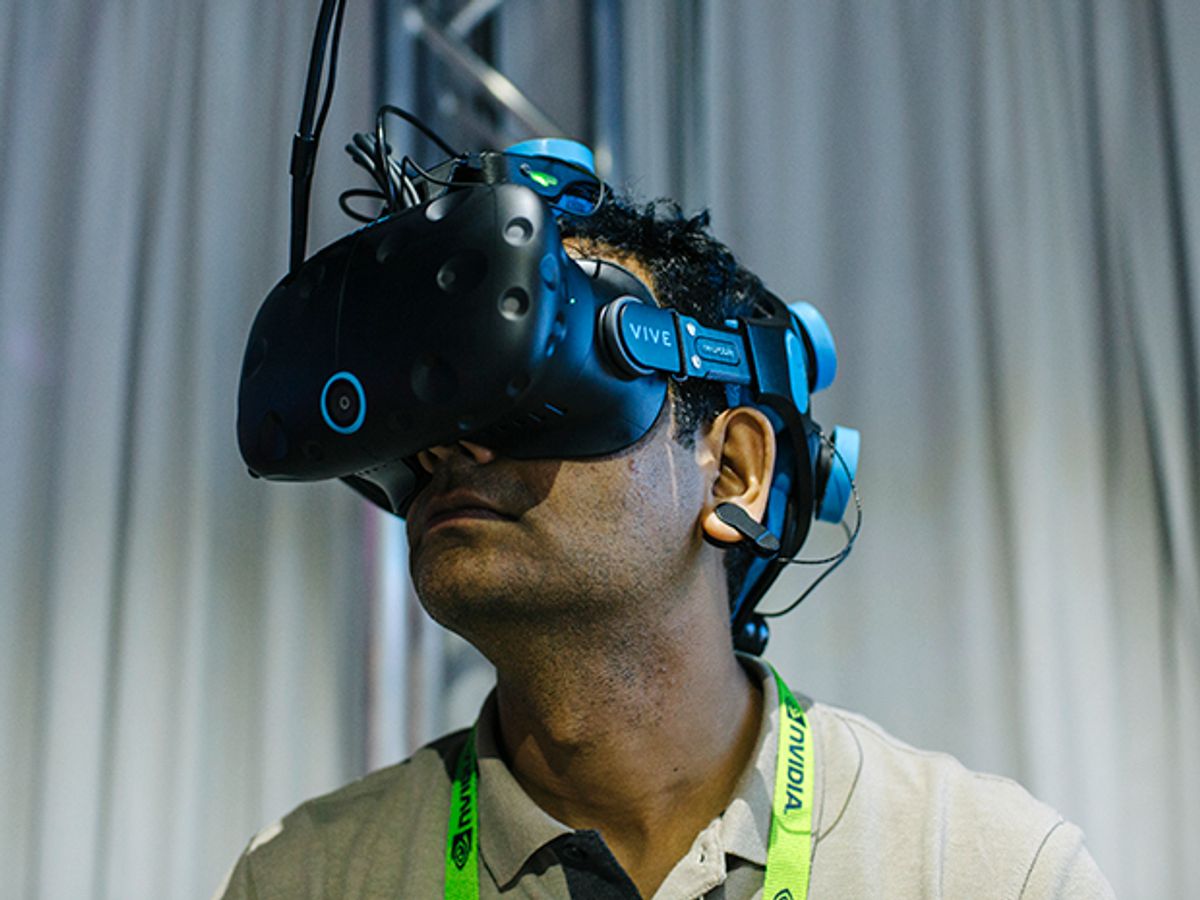A man wears a VR headset to play a mind-controlled game in virtual reality.