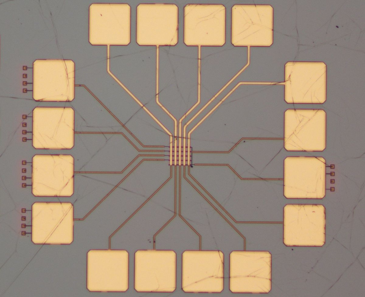 A micrograph with gold squares and connections in the center array.