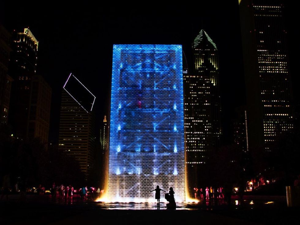 A night shot of the Crown Fountain in Chicago\u2019s Millennium Park