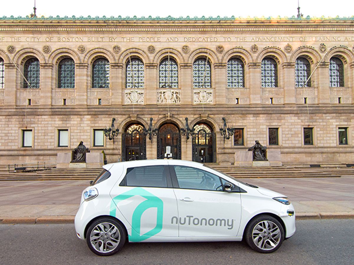 A NuTonomy self-driving taxi in front of a grand-looking building, the Boston Public Library