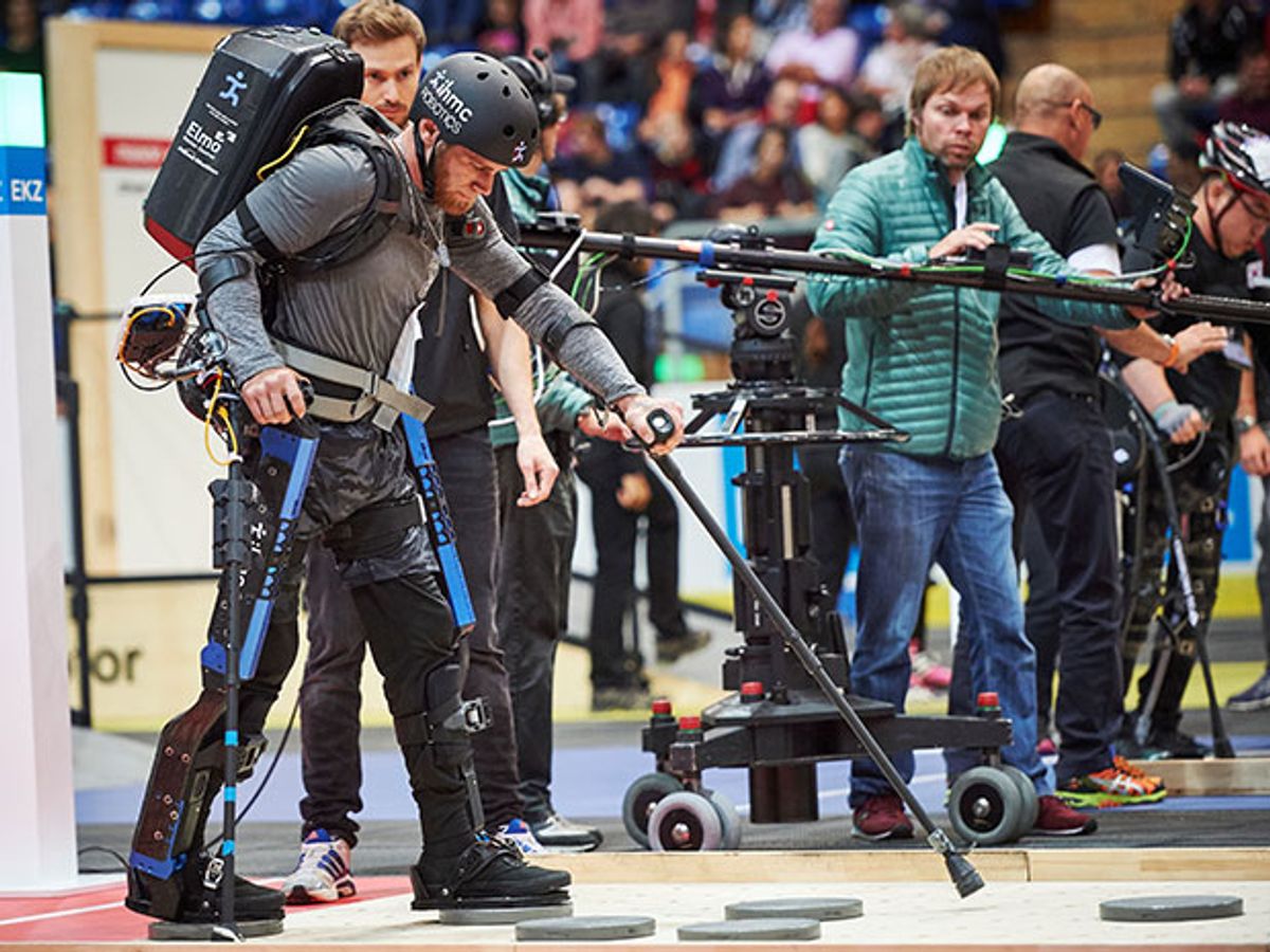 A paraplegic man wearing a robotic exoskeleton competes in a race during the Cybathlon, the world's first cyborg Olympics.