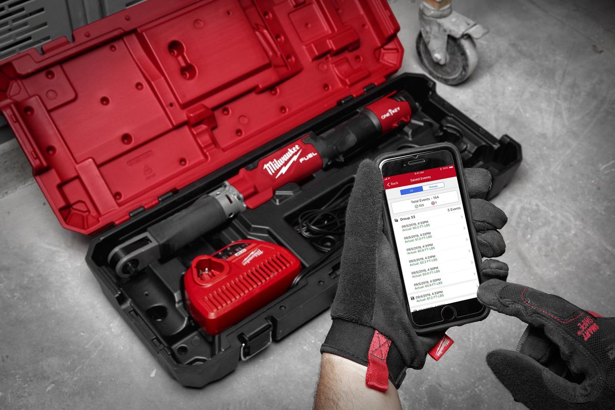A person operates a smartphone app that connects with Milwaukee Tool hardware