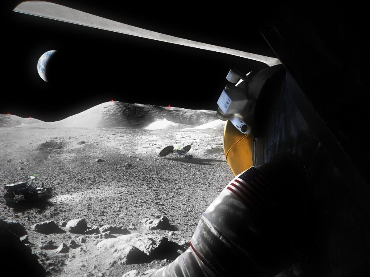a person wearing an astronaut suit while looking out over black and white rocky terrain with crescent of Earth in the background 