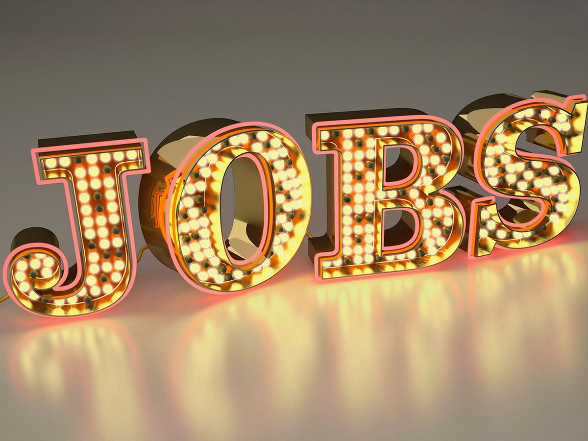 A photo illustration shows a big sign that says JOBS in all caps and flashing lights.