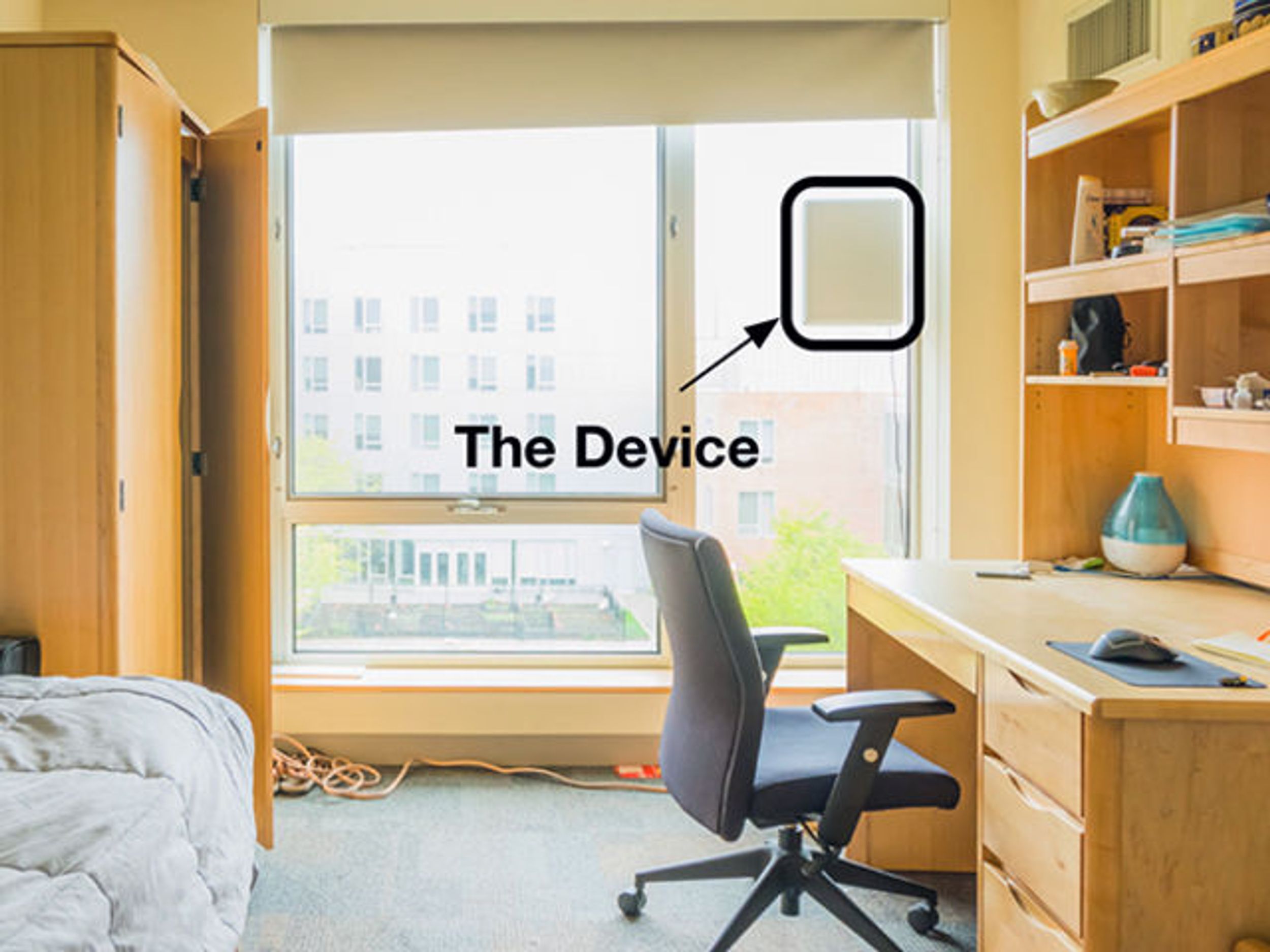 A photo illustration shows a laptop-sized device that monitors sleep patterns mounted to a window in a home office 