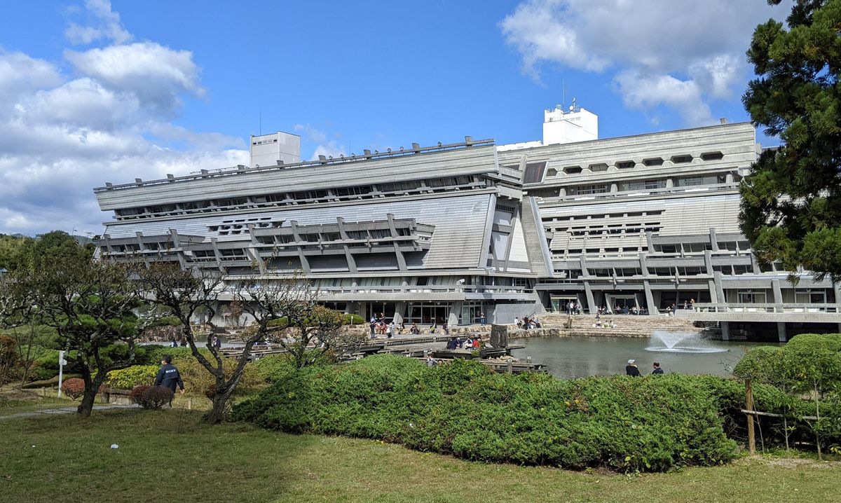 A photo of a large conference center in Japan on a sunny day