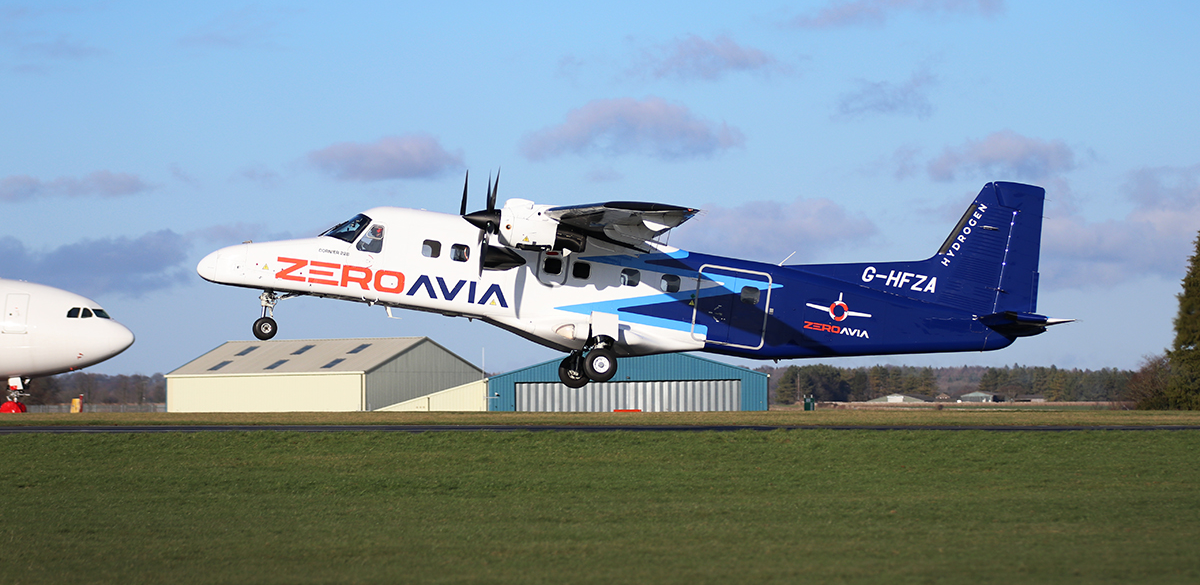 A photo of a plane taking off with "zeroavia" on the front. 